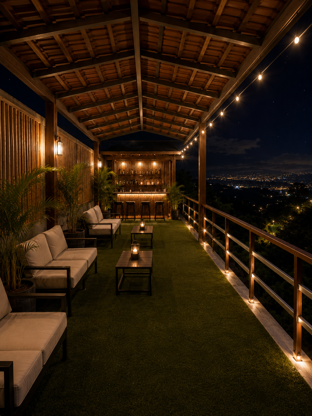 El Mirador — a covered terrace lounge with string lights and valley views at night